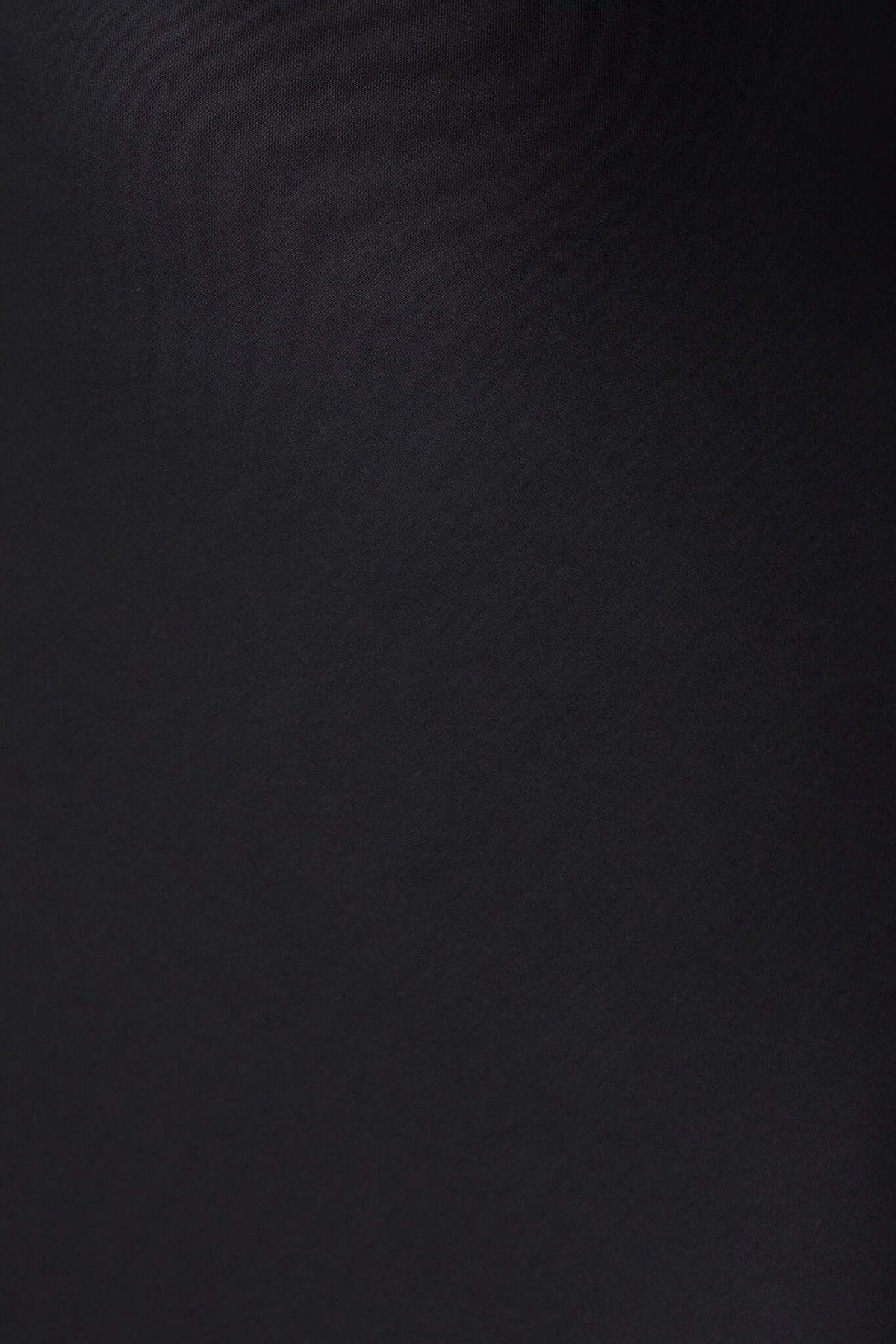 Close-up of soft black fabric showcasing the texture of the Erie Maxi Dress.