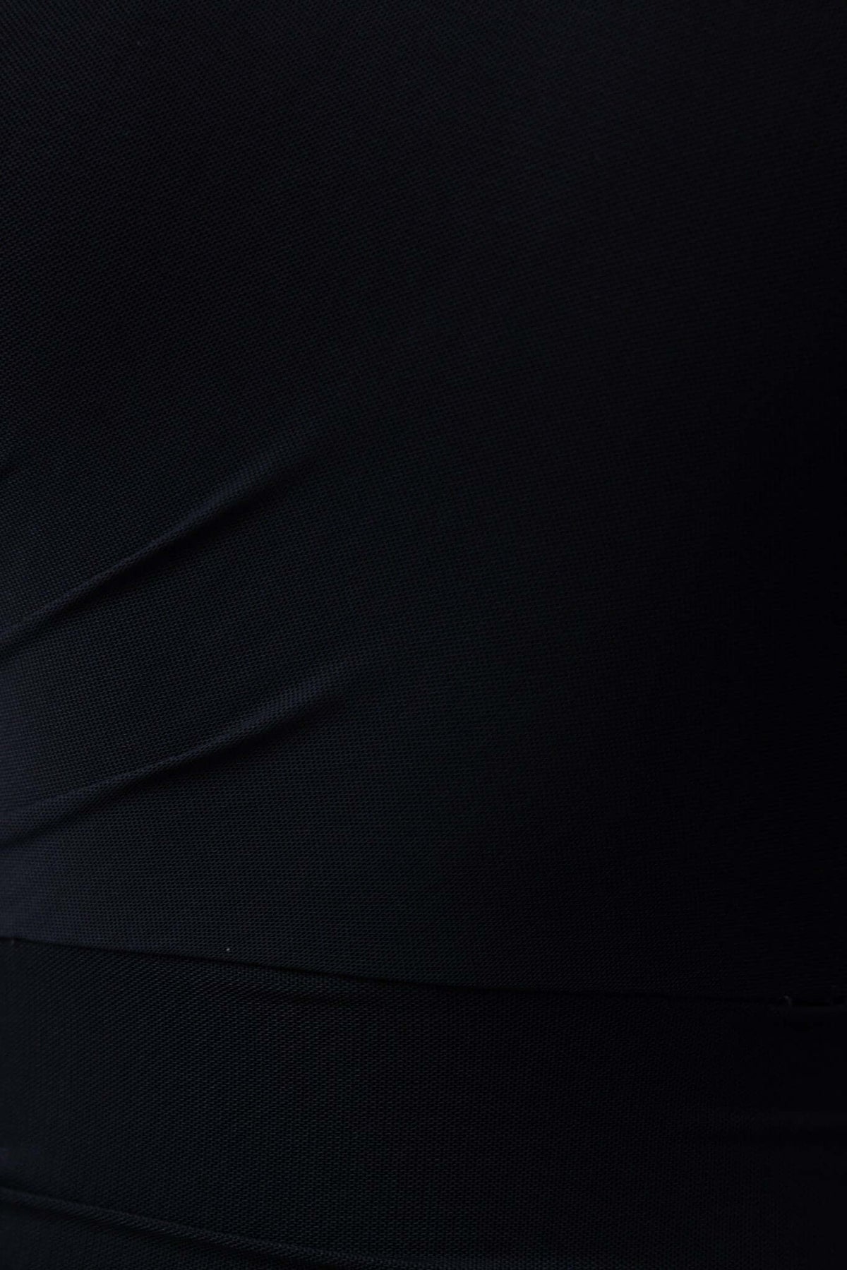 Close-up of black fabric showcasing ruching and stretch in the Stolen Kiss Maxi Dress.