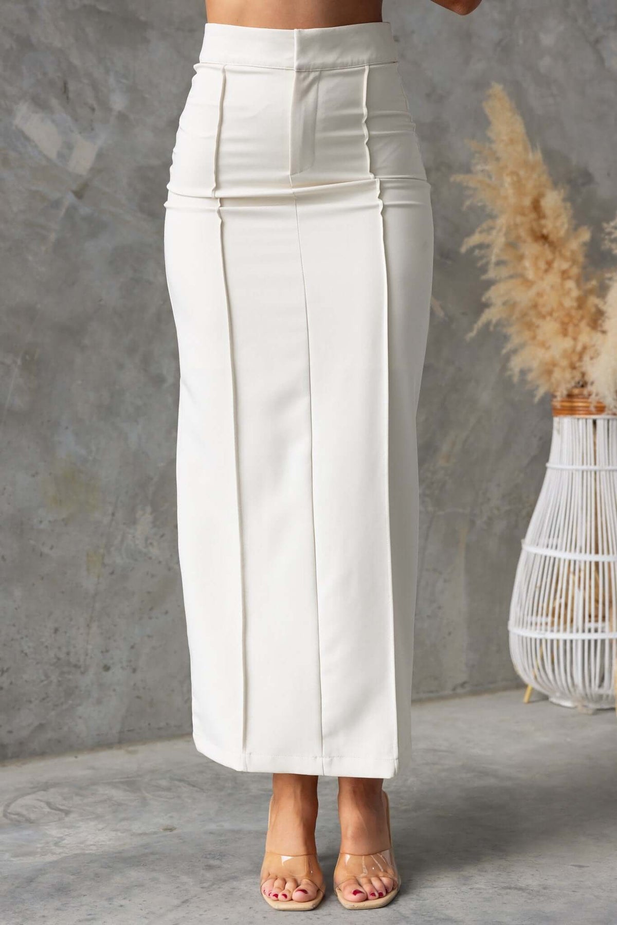 Jayne Maxi Skirt in cream, featuring a mid-high waist, back split, lined to mid-thigh, and tailored fit.