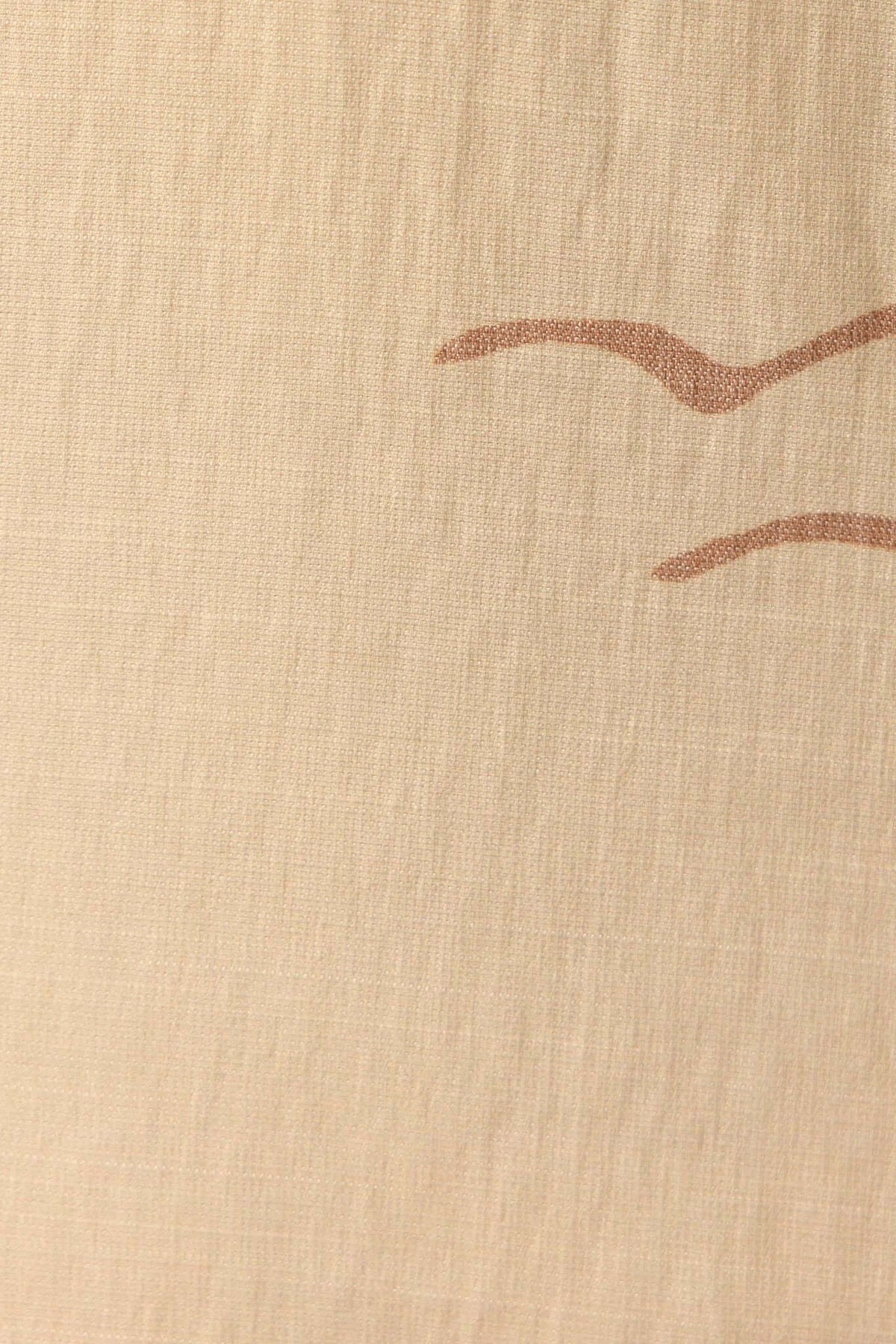 Close-up of light fabric featuring subtle abstract lines, ideal for a stylish maxi dress.