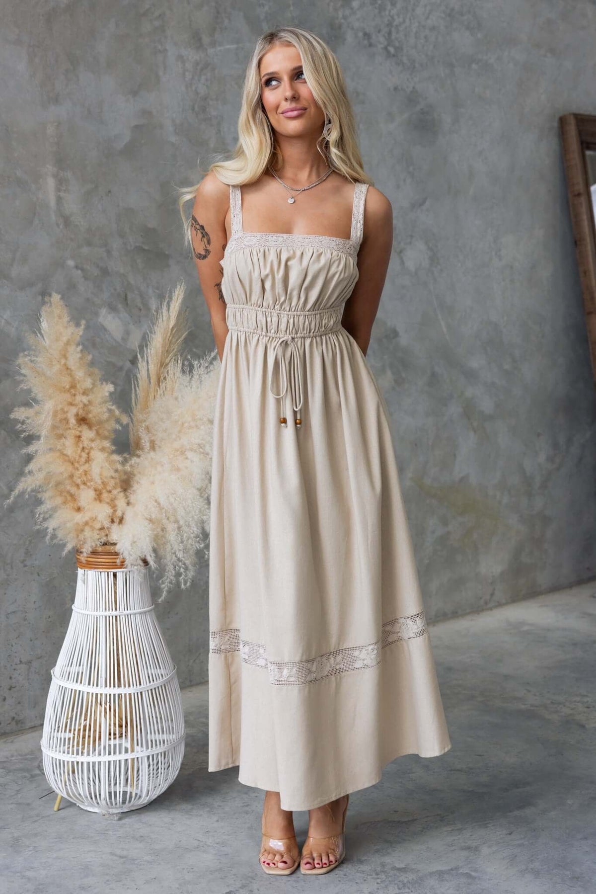 Eletti Midi Dress in beige with lace detailing, elastic waist, tie at waist, and elegant linen look.