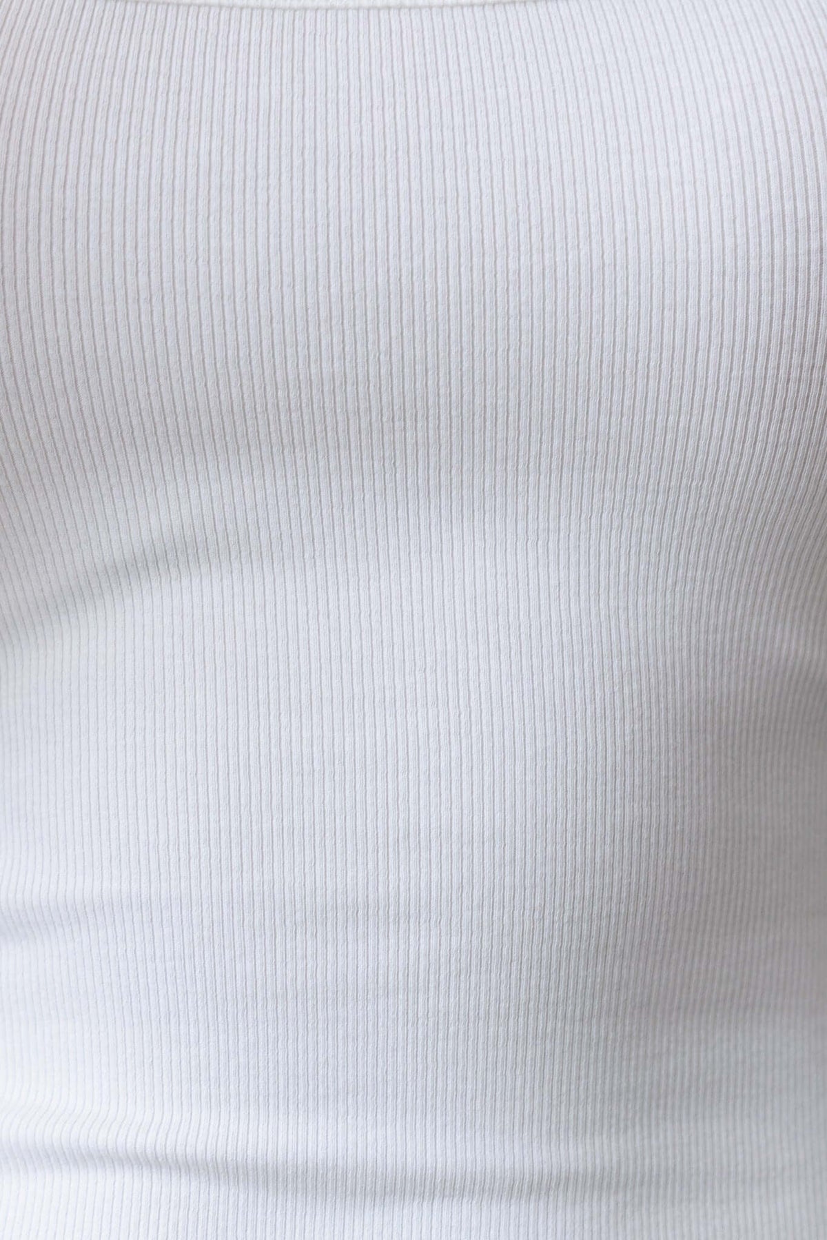 Close-up of a light ribbed fabric, showcasing a smooth texture ideal for layering or as an undergarment.