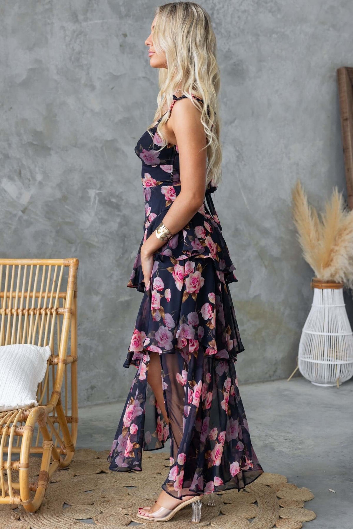 Klaudia floral print maxi dress with adjustable straps and front split, worn by a model against a stylish background.