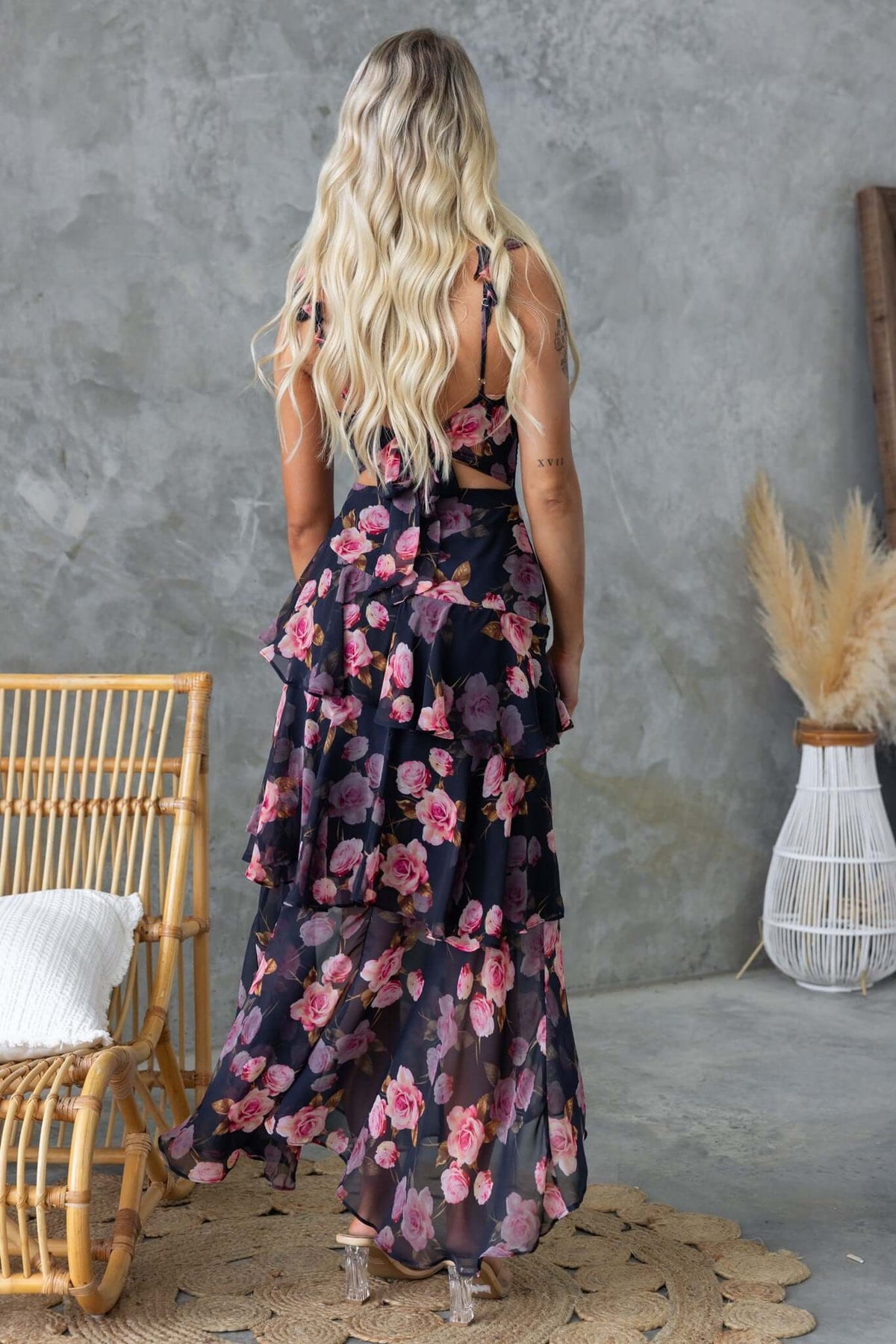 Back view of Klaudia Maxi Dress featuring floral print and layered ruffles, perfect for summer occasions.