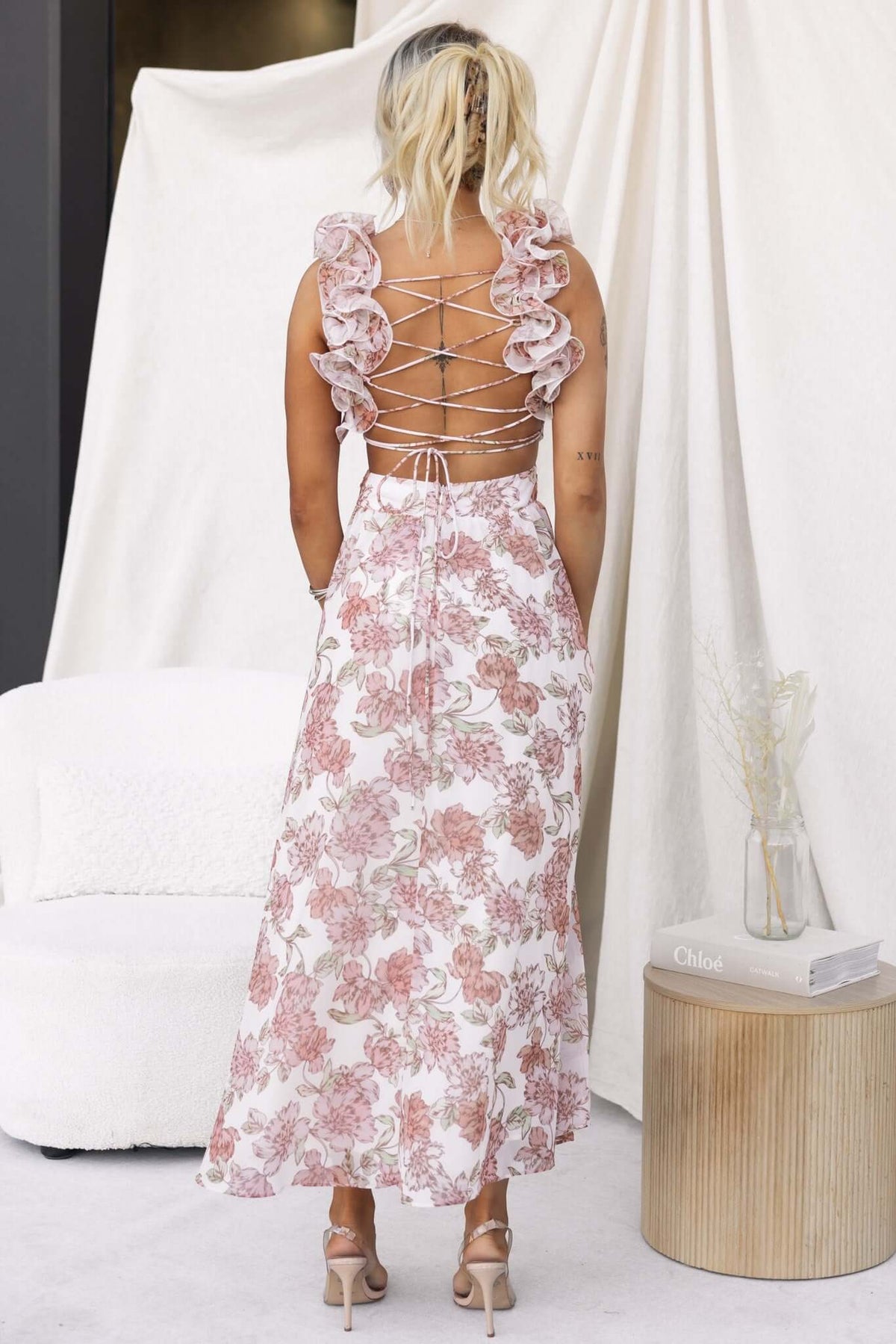 Back view of Luciana Maxi Dress featuring ruffle straps and lace-up detail, perfect for elegant summer occasions.