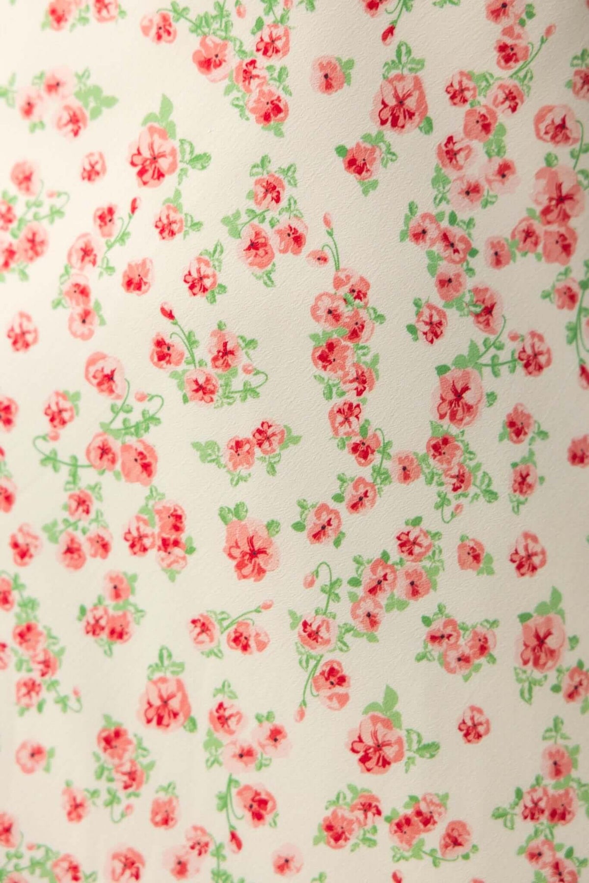 Floral pattern featuring pink and green flowers on a soft cream background, perfect for a summer maxi dress.