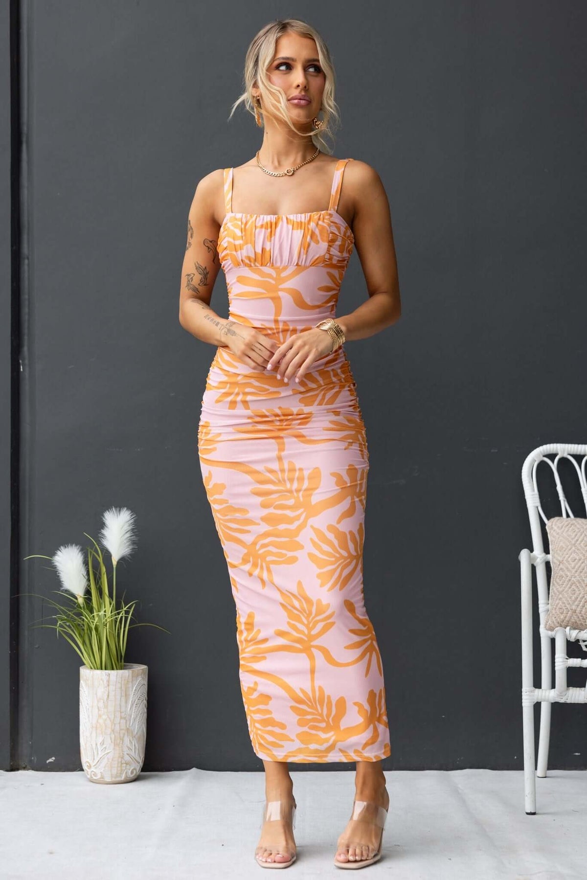 Giorgi Maxi Dress featuring a floral print, adjustable straps, and ruching perfect for a stylish summer look.