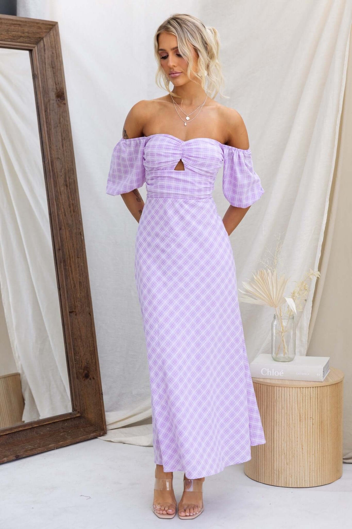 Elayna Maxi Dress with off-shoulder sleeves and cut-out detail, featuring a stylish lilac check pattern.