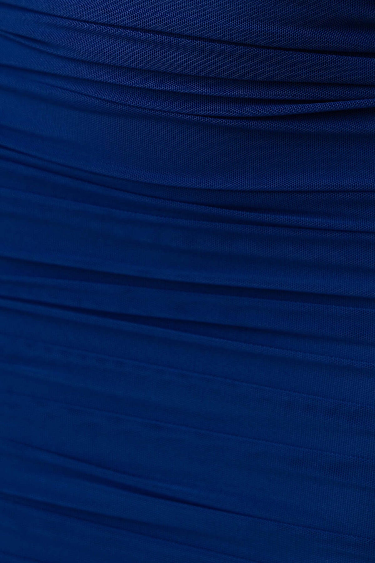 Close-up of the fabric texture of the Truly Mine Midi Dress in deep blue, showcasing its stretch and smooth ruched design.