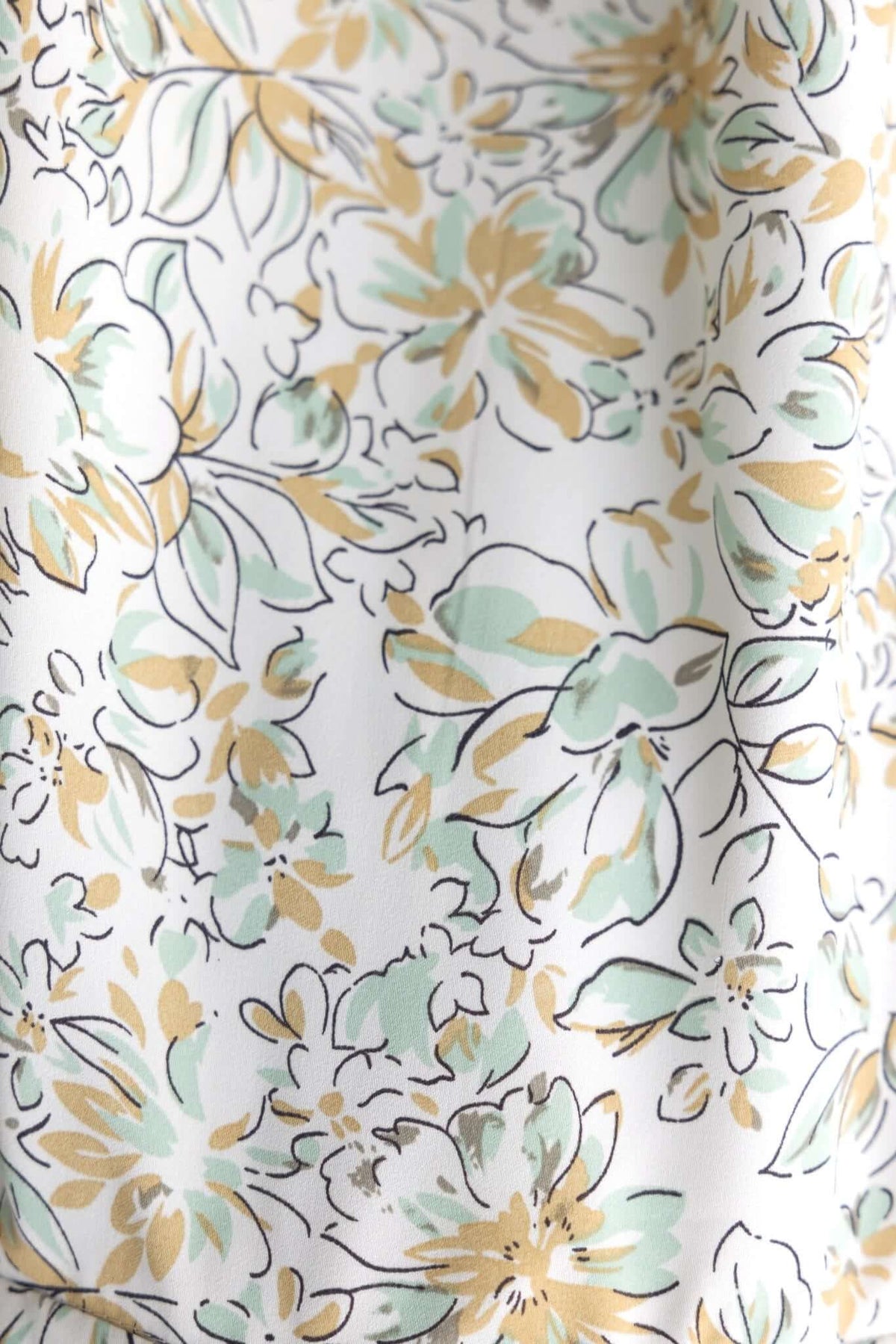 Floral fabric pattern featuring mint green and gold flowers on a white background, perfect for the Dewy Playsuit.