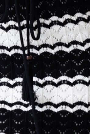Close-up of Henree Dress showing crochet detail in black and white with removable tie accents.