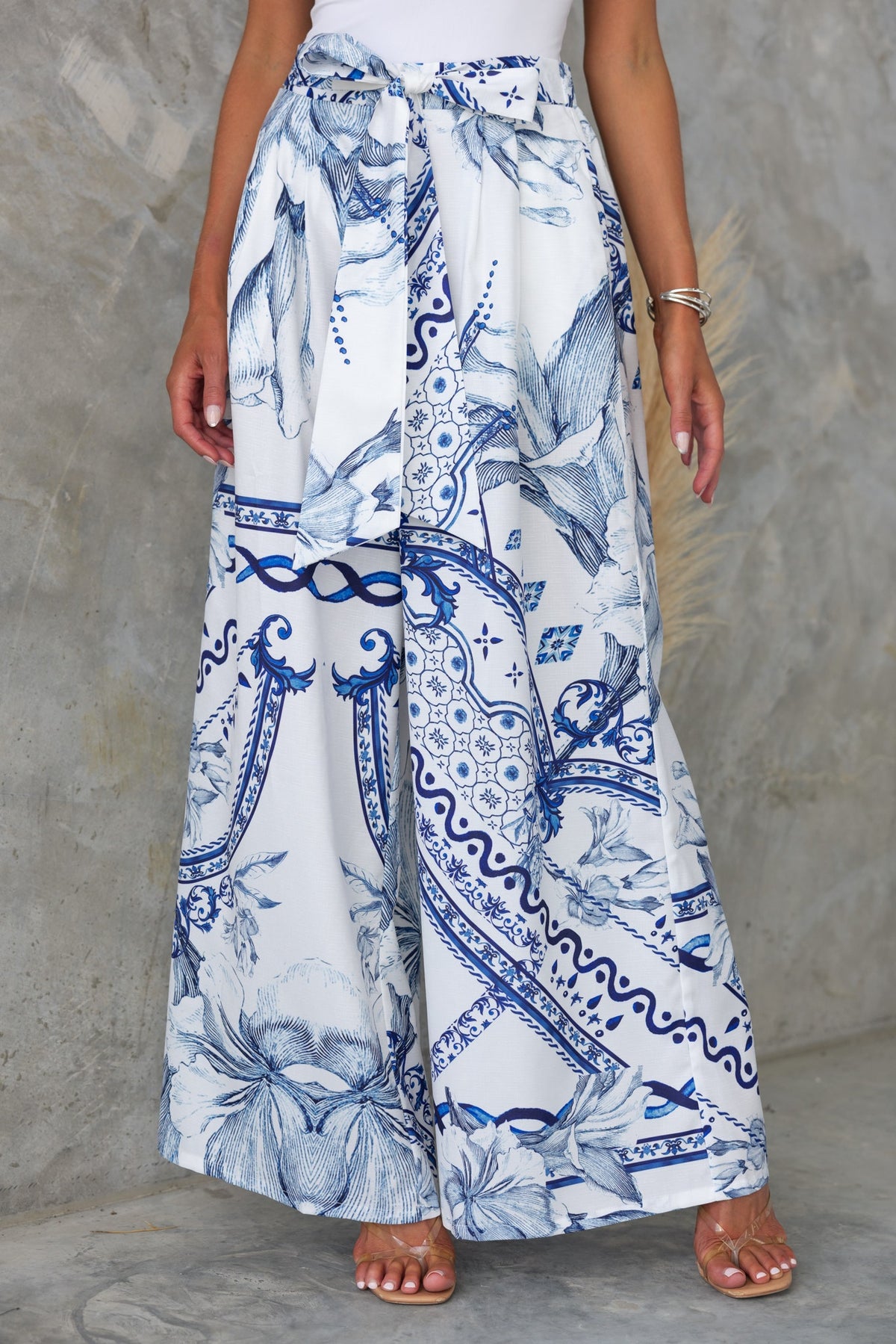 Elvia Pants featuring an abstract navy and white print, mid-high waist, and comfortable wide-leg fit.