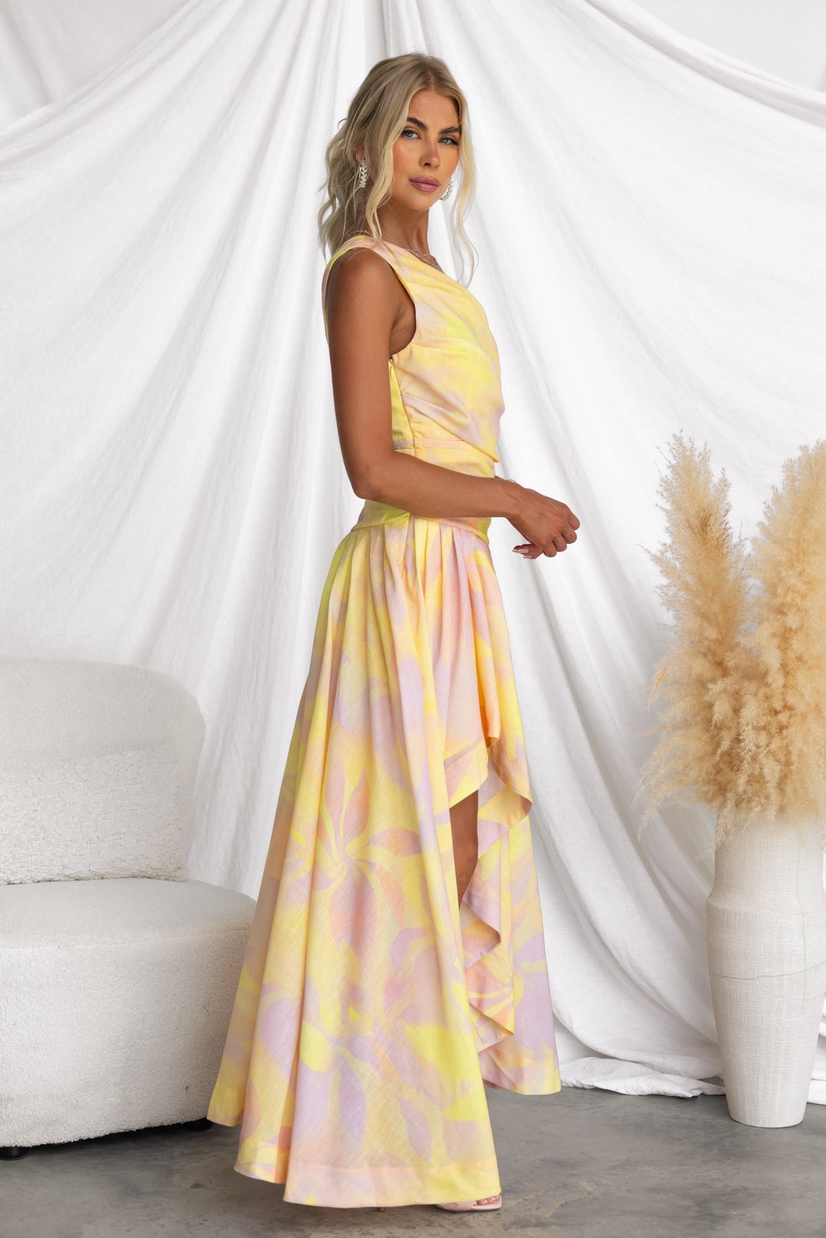 Multi-colour Horizons Maxi Dress with one-shoulder neck and asymmetrical hemline, styled on a model in a bright setting.
