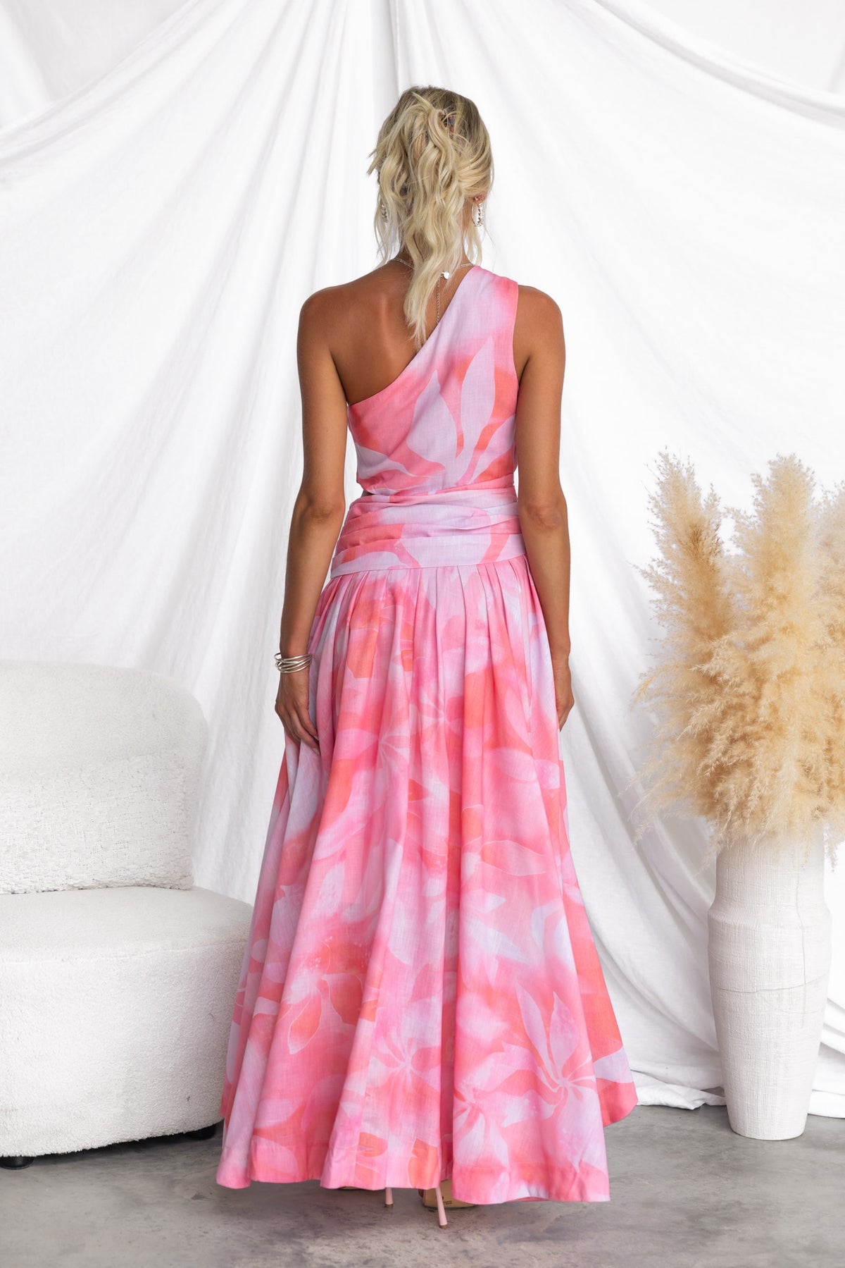 Back view of a multi-colour Horizons Maxi Dress featuring a one-shoulder neckline and asymmetrical hemline.