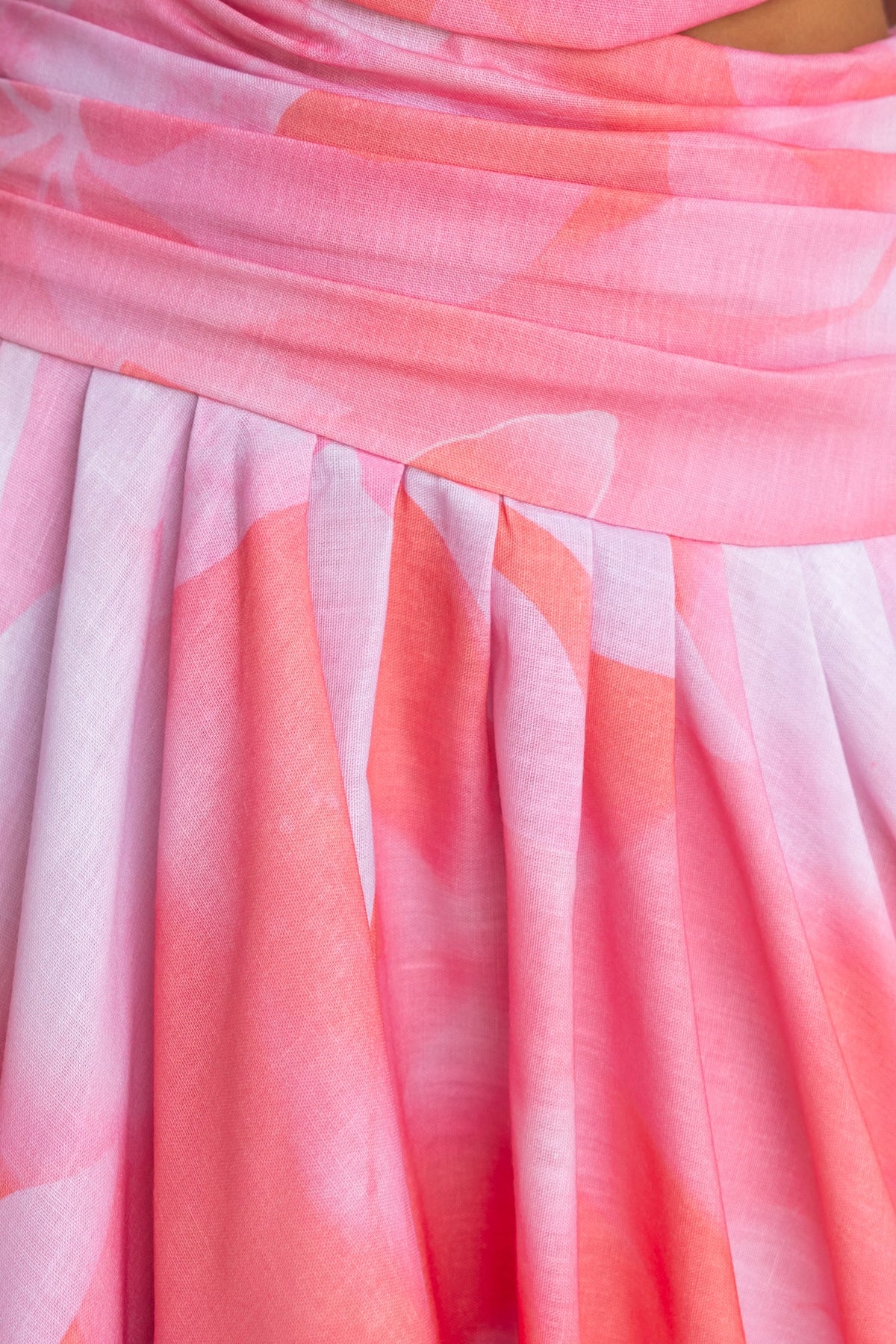 Close-up detail of the Horizons Maxi Dress featuring multi-colour fabric with pleats and a one-shoulder design.