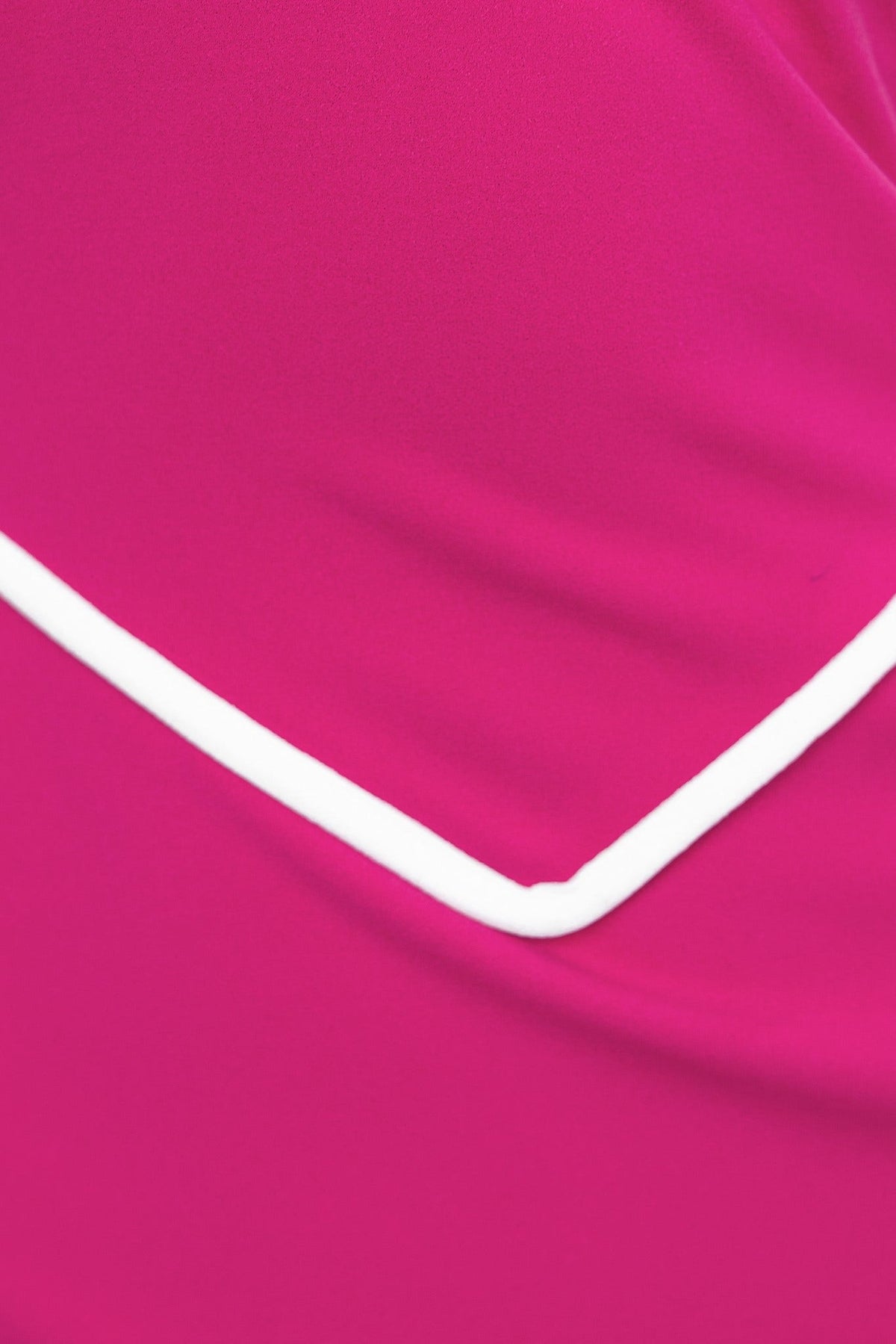 Close-up of Heads Turn Maxi Dress featuring a vibrant pink fabric with a white outline detail.