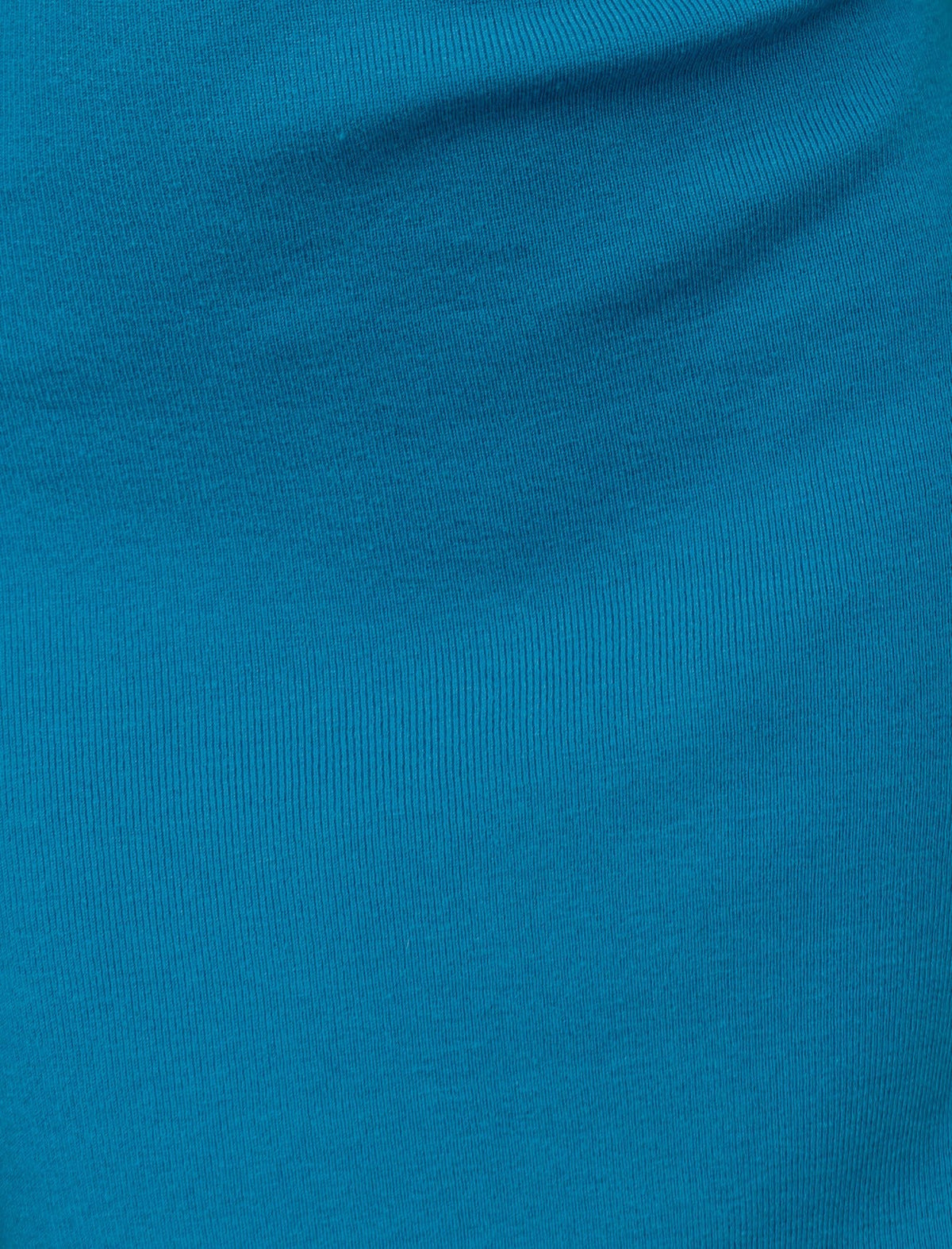 Close-up of teal ribbed knit fabric used in Lenora Midi Dress, showcasing its stretch and texture.