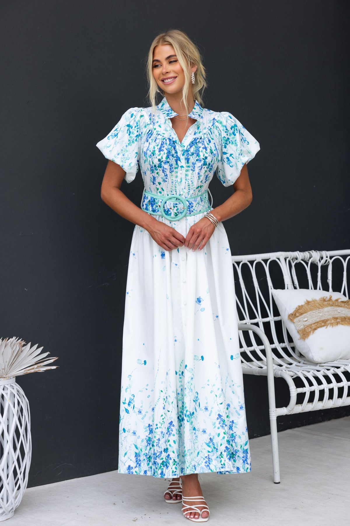 Younger Now Floral Maxi Dress featuring a high neckline and a belted waist, styled in blue and white colors.