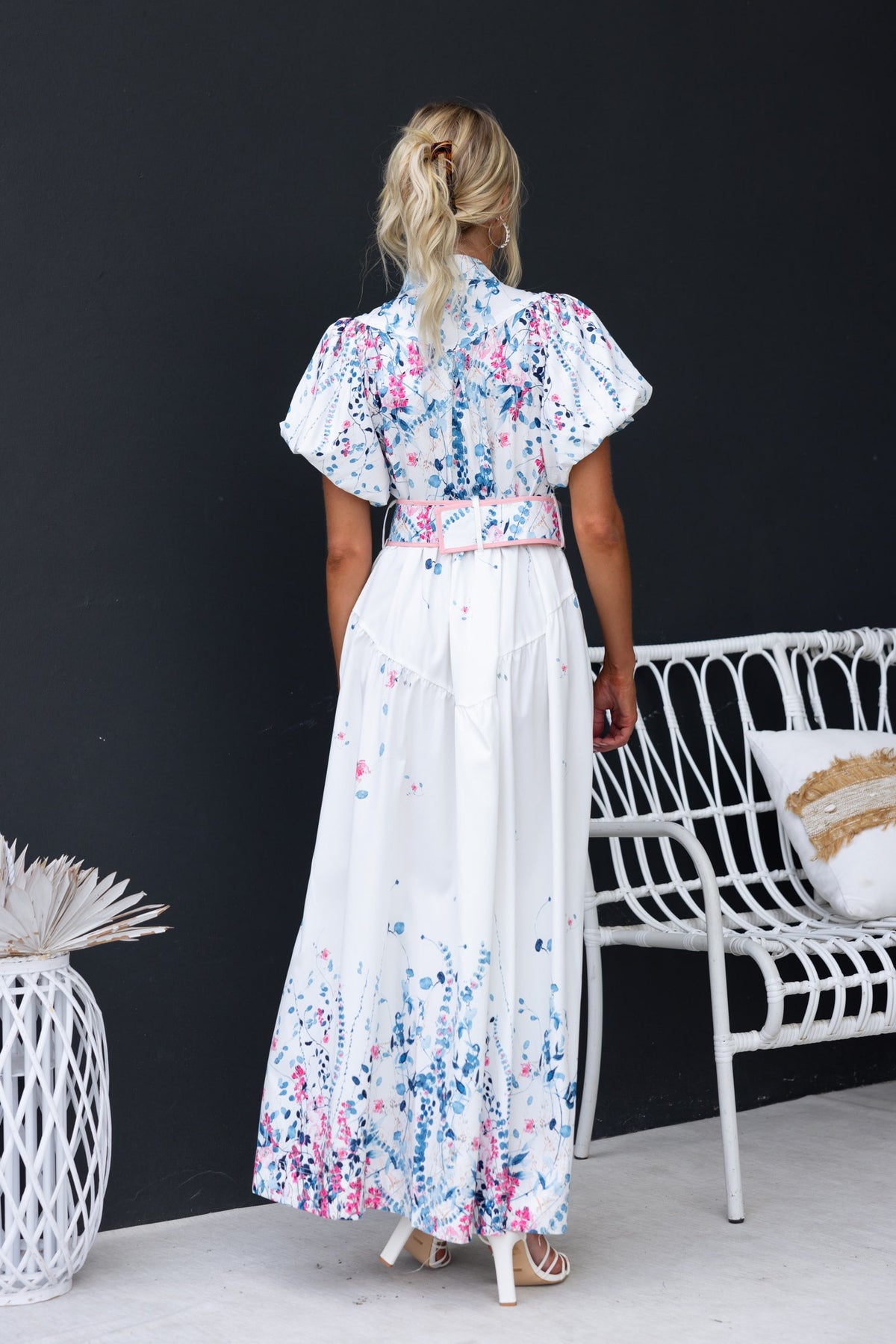 Back view of the Younger Now Maxi Dress featuring floral print, elastic sleeves, and removable belt.