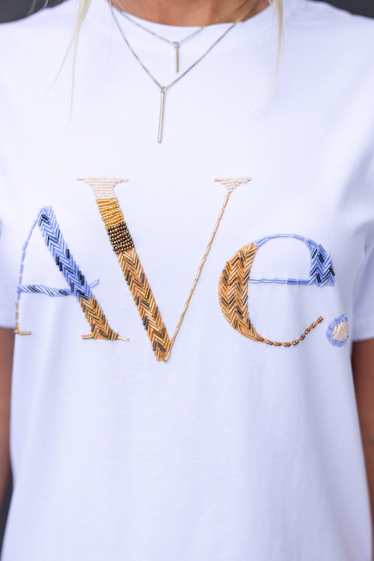 Cesca Tee featuring embroidered 'Ave' design on a soft cotton tee, perfect for casual wear.