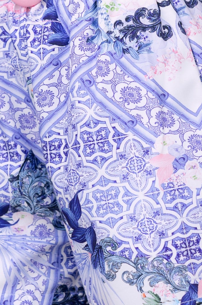 Close-up of Tarni Shorts featuring an abstract blue and white print with floral accents.