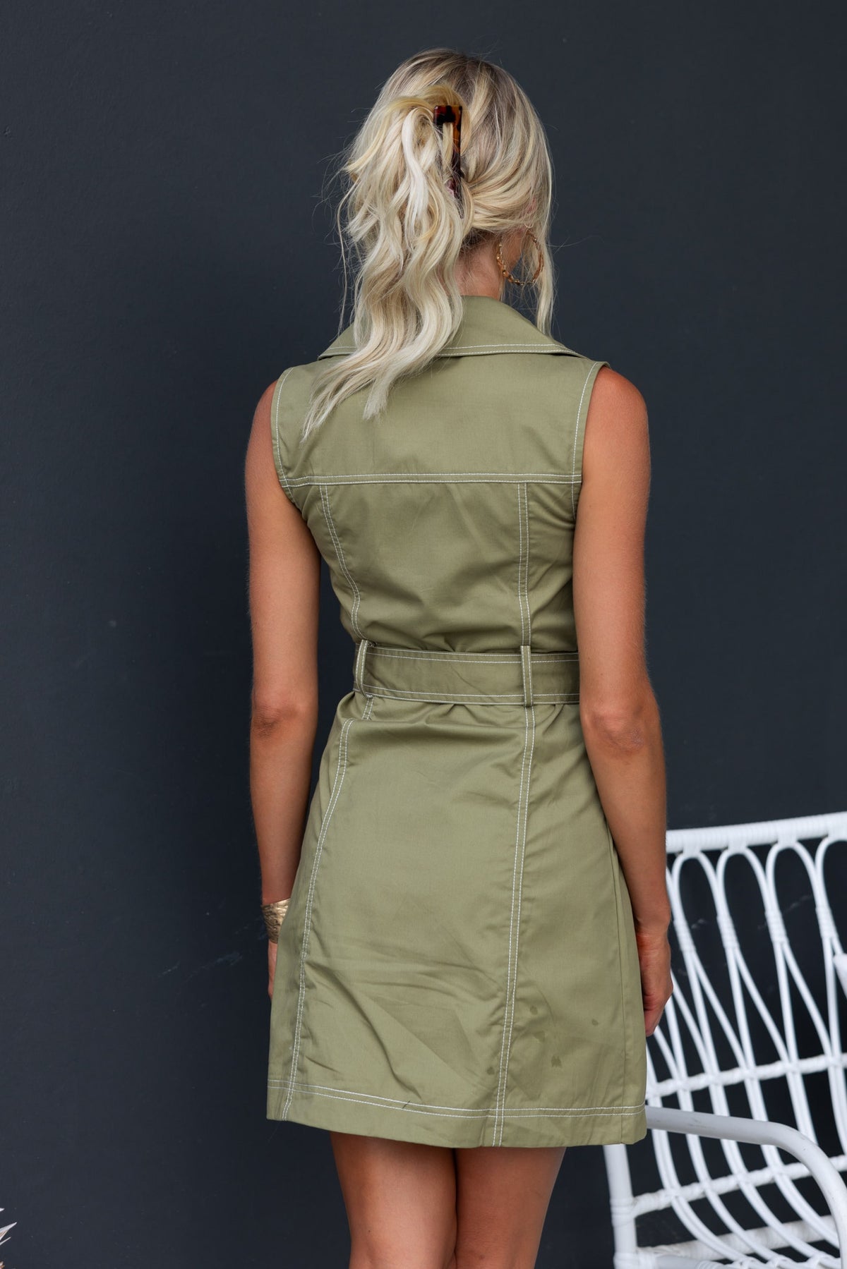 Back view of a green Tammy Dress featuring a collar, button-up front, and removable fabric tie.