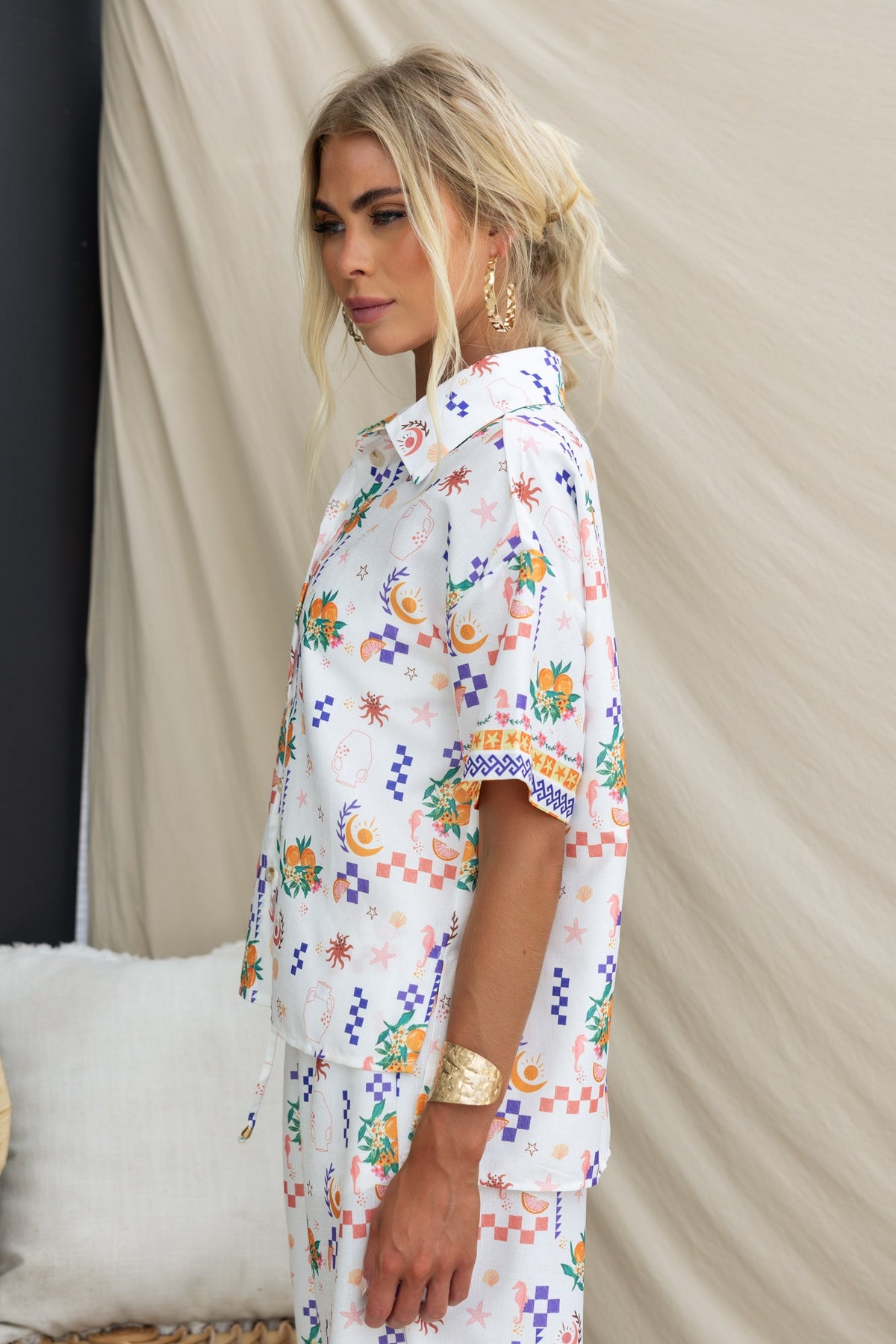 Model wearing the Talei Shirt featuring an abstract print, collar, and linen look, styled for a relaxed fit.