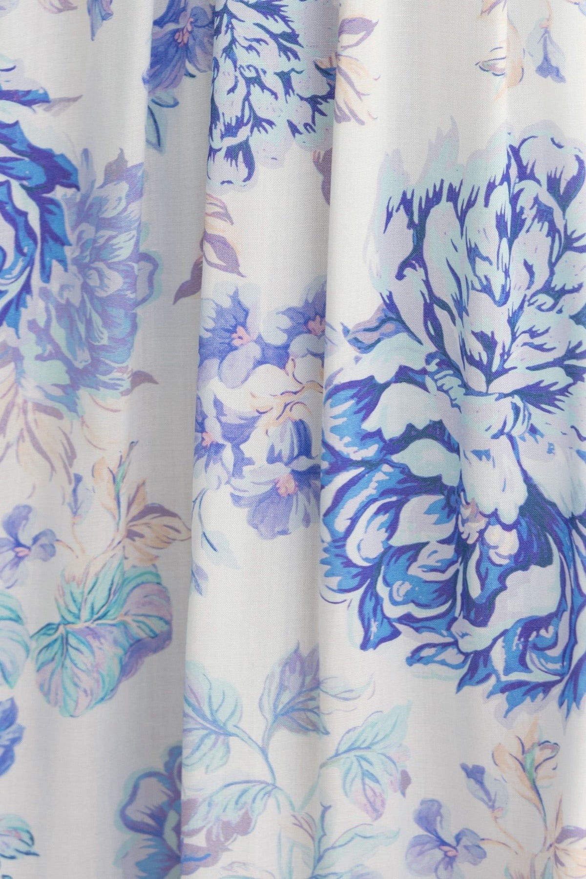 Floral print fabric featuring blue and purple flowers on a light background, perfect for a midi dress.