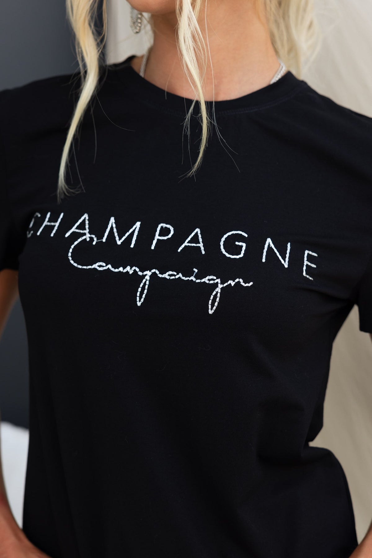 BlackPrint Wyatt Tee featuring 'Champagne Campaign' design with metallic threading and soft cotton feel.