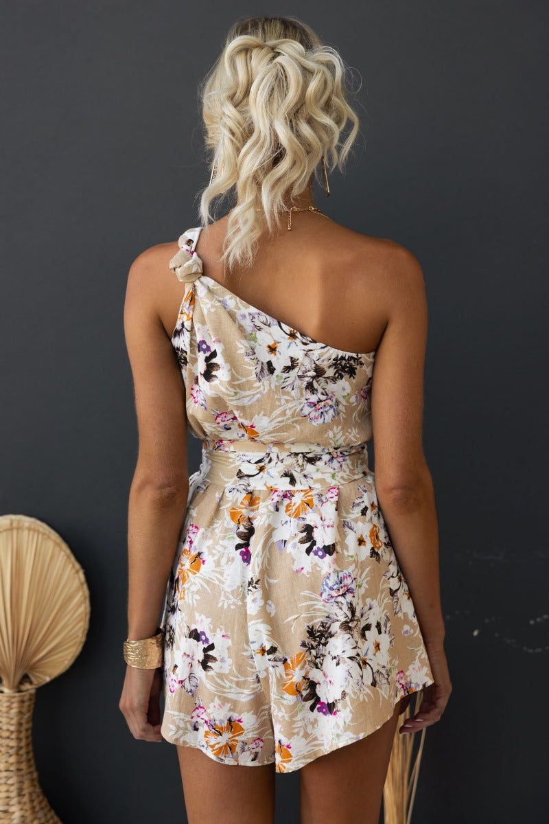 Back view of Valetta Playsuit featuring floral design, one-shoulder neckline, and elastic waistband.