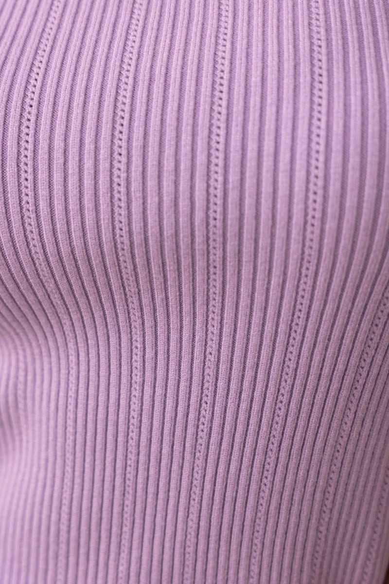 Close-up of the ribbed texture of the Steph Top in soft lavender, showcasing its stretch material and stylish design.