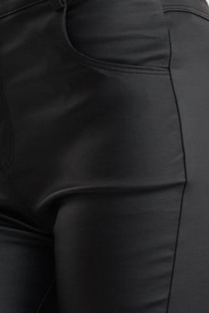 Close-up of Leni Pants in black faux leather showcasing mid-high waist fit and pocket detail.
