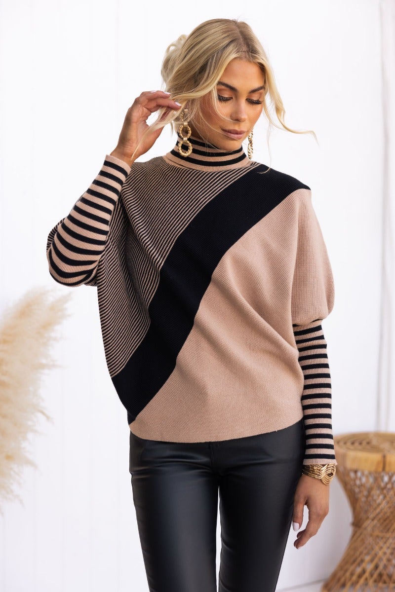 Reality Check Jumper in ribbed knit with batwing sleeves and turtle neckline, styled with faux leather pants.