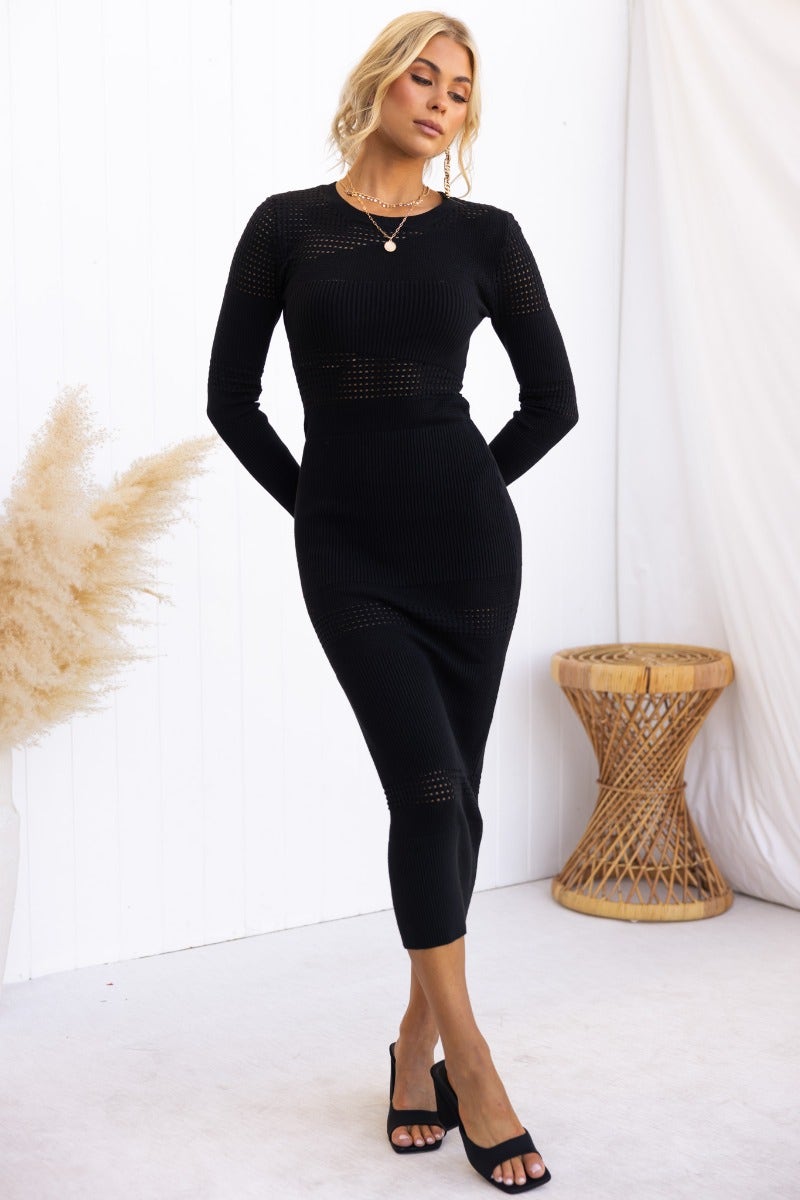Fenna Midi Dress in black with ribbed knit and open weave detailing, a stylish and comfortable addition to any wardrobe.