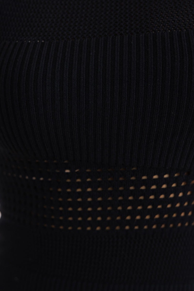 Close-up of black ribbed knit fabric with open weave detailing from the Fenna Midi Dress.