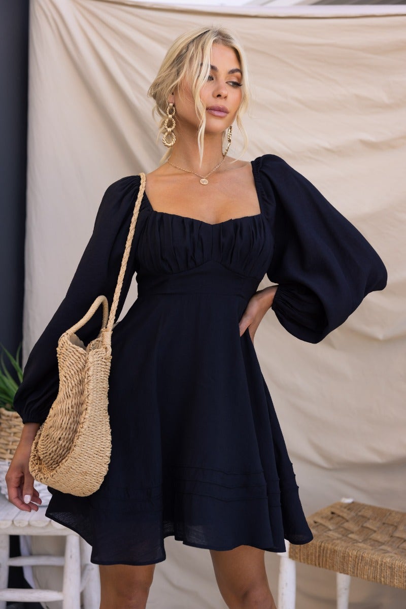 Amos Dress: Black dress with sweetheart neckline, elastic sleeves, and lined design, perfect for a stylish look.