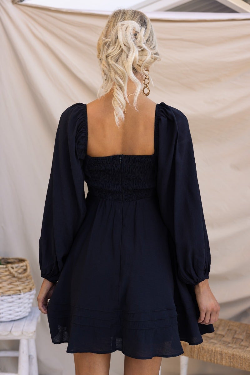 Back view of the Amos Dress featuring a sweetheart neckline, elastic sleeves, and an invisible zip detail.