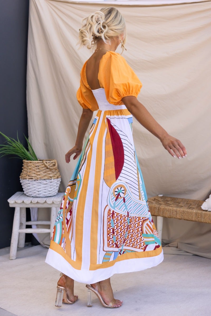 Turner Maxi Dress featuring a multi-colour design, square neckline, and elastic fittings, perfect for summer outings.