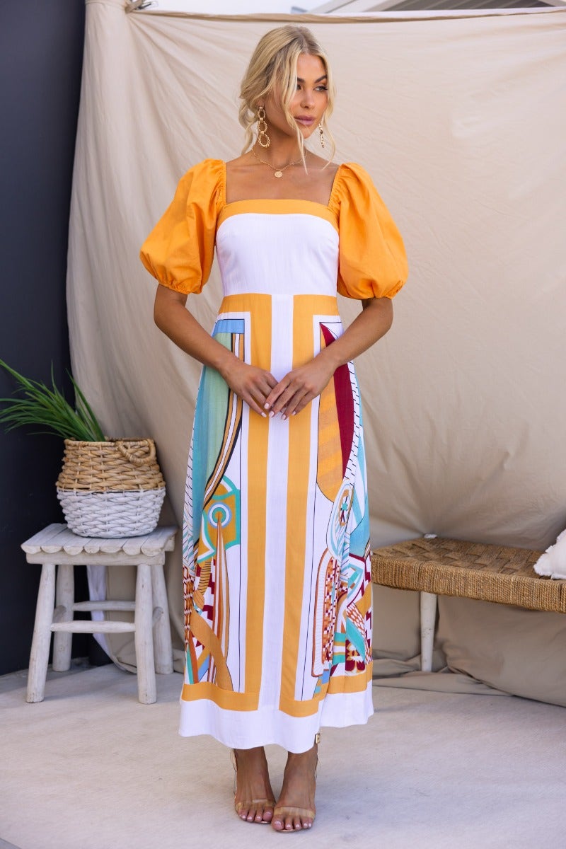 Turner Maxi Dress featuring a square neckline, puff sleeves, and colorful print, perfect for summer outings.