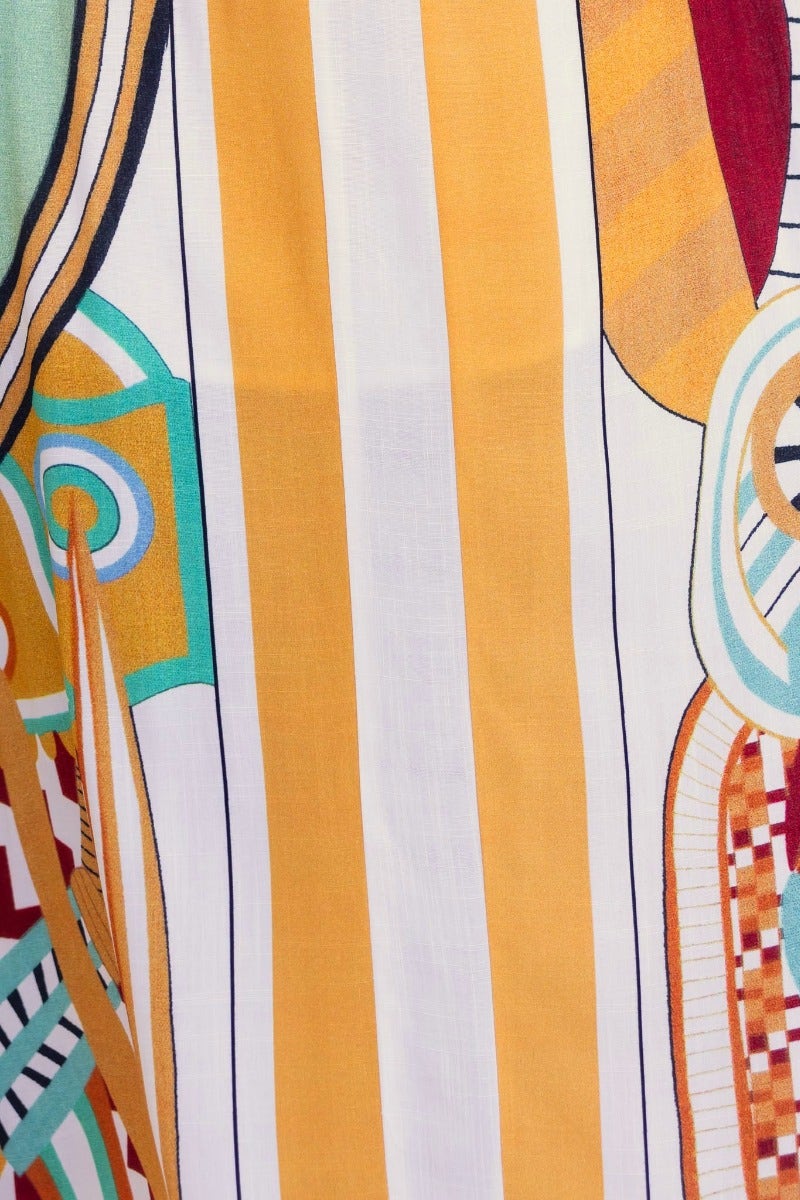 Colorful fabric close-up of the Turner Maxi Dress featuring bold stripes and abstract patterns.
