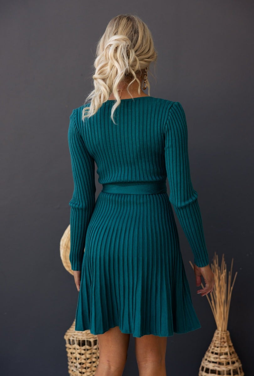 Back view of Cadello Dress in ribbed knit, featuring a round neckline and removable fabric belt for a stylish fit.