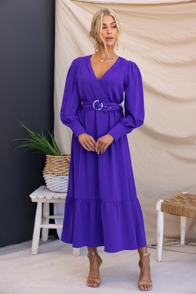 Alizzie Midi Dress in purple featuring a V-neckline, elastic waistband, removable belt, and gathered skirt. Perfect for any occasion.