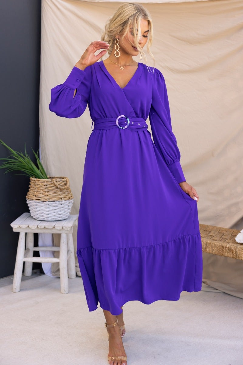 Model wearing a purple Alizzie midi dress with V-neckline, elastic waistband, and removable belt, styled for summer.