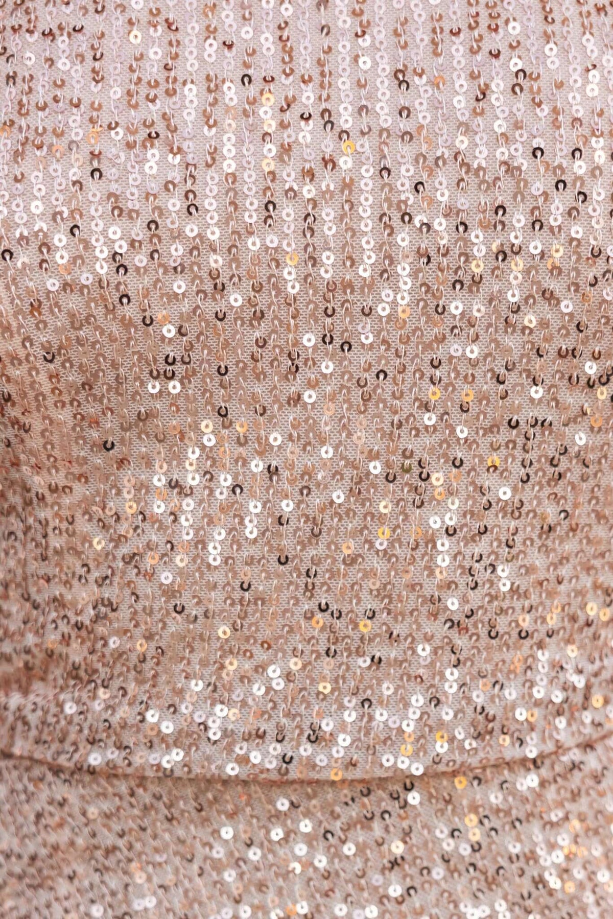 Close-up of Haines Dress showing sparkling sequins in gold and champagne hues on a stretch fabric.
