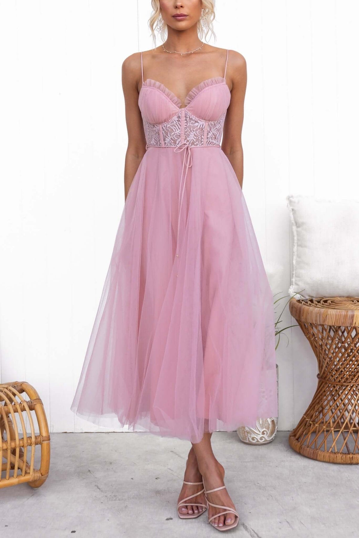 Model wearing Wash Away Maxi Dress in blush pink with tulle skirt, lace detail, and adjustable straps.