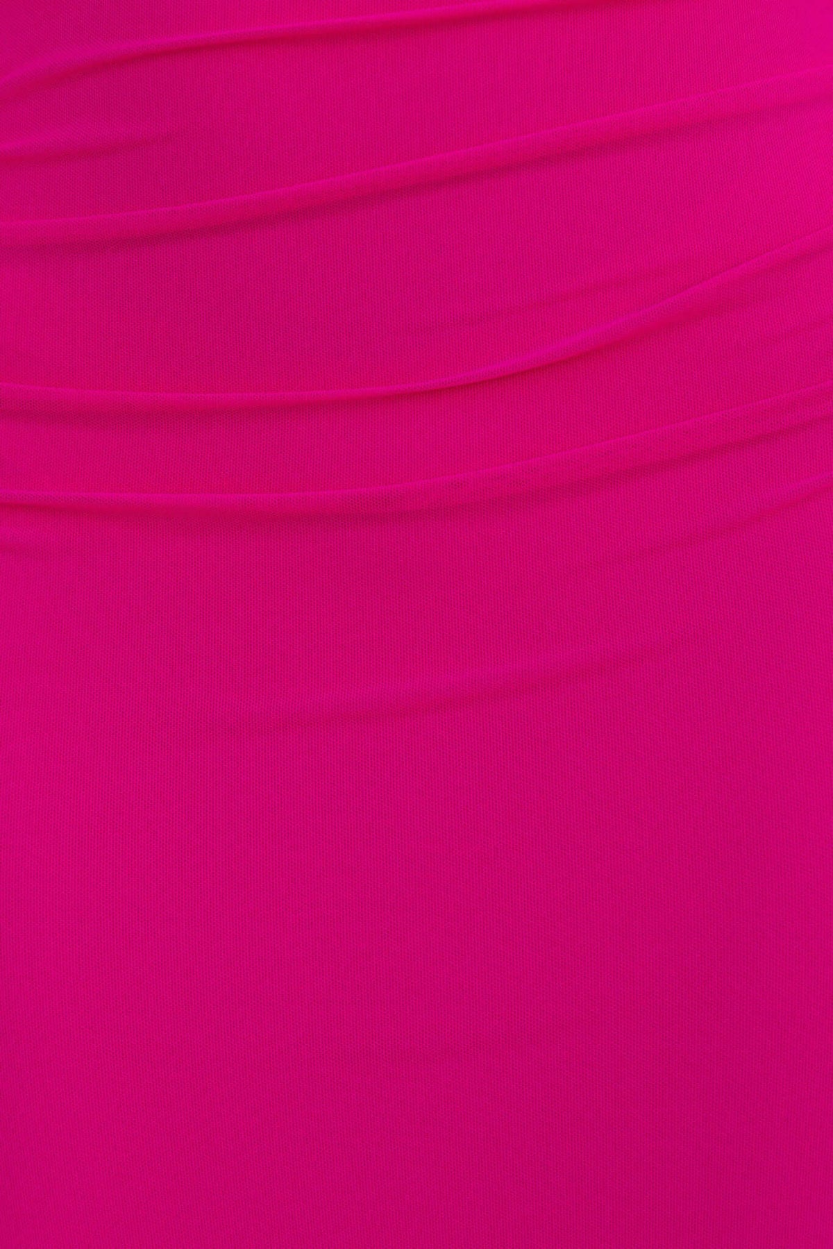 Close-up of the soft, stretchy pink fabric of the Aletta Midi Dress, showcasing its sleek texture and vibrant color.