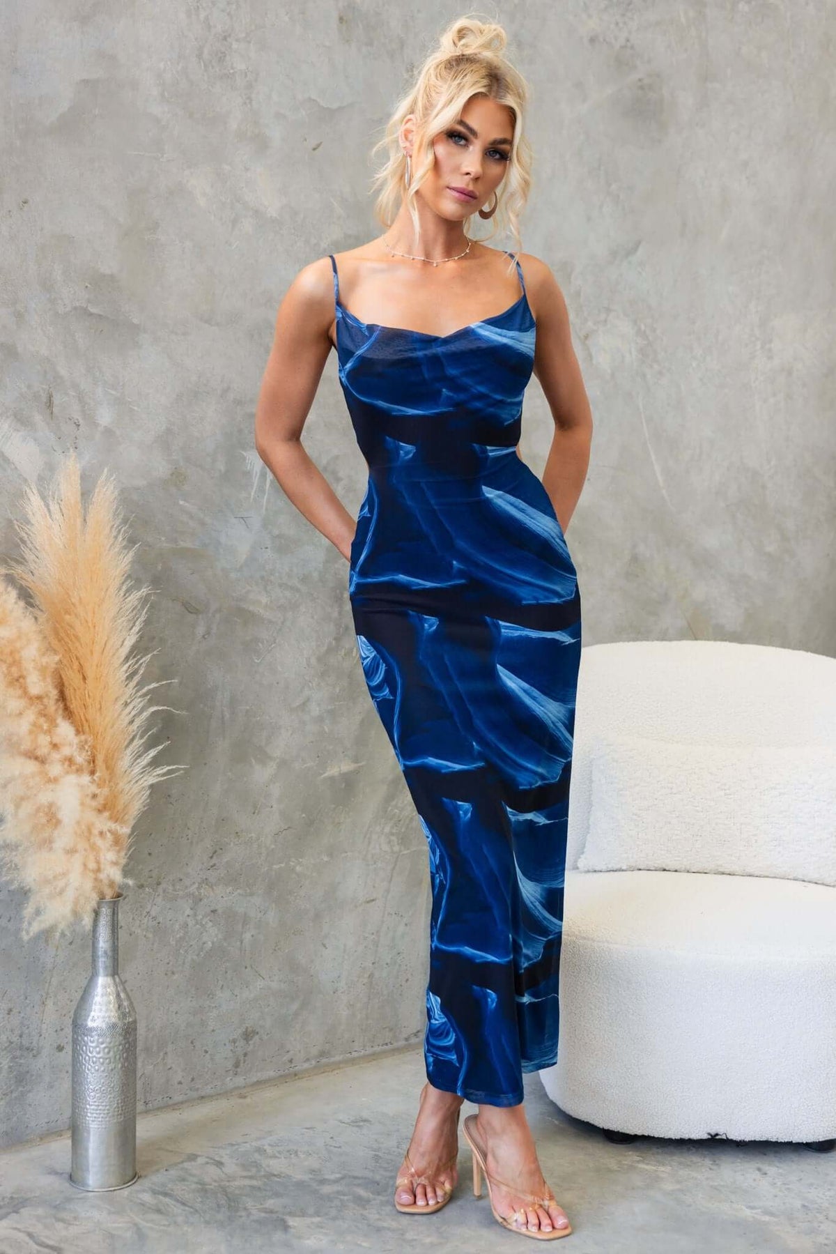 Kalena Maxi Dress in navy with adjustable straps and cowl neckline, showcasing a stylish, fitted silhouette.