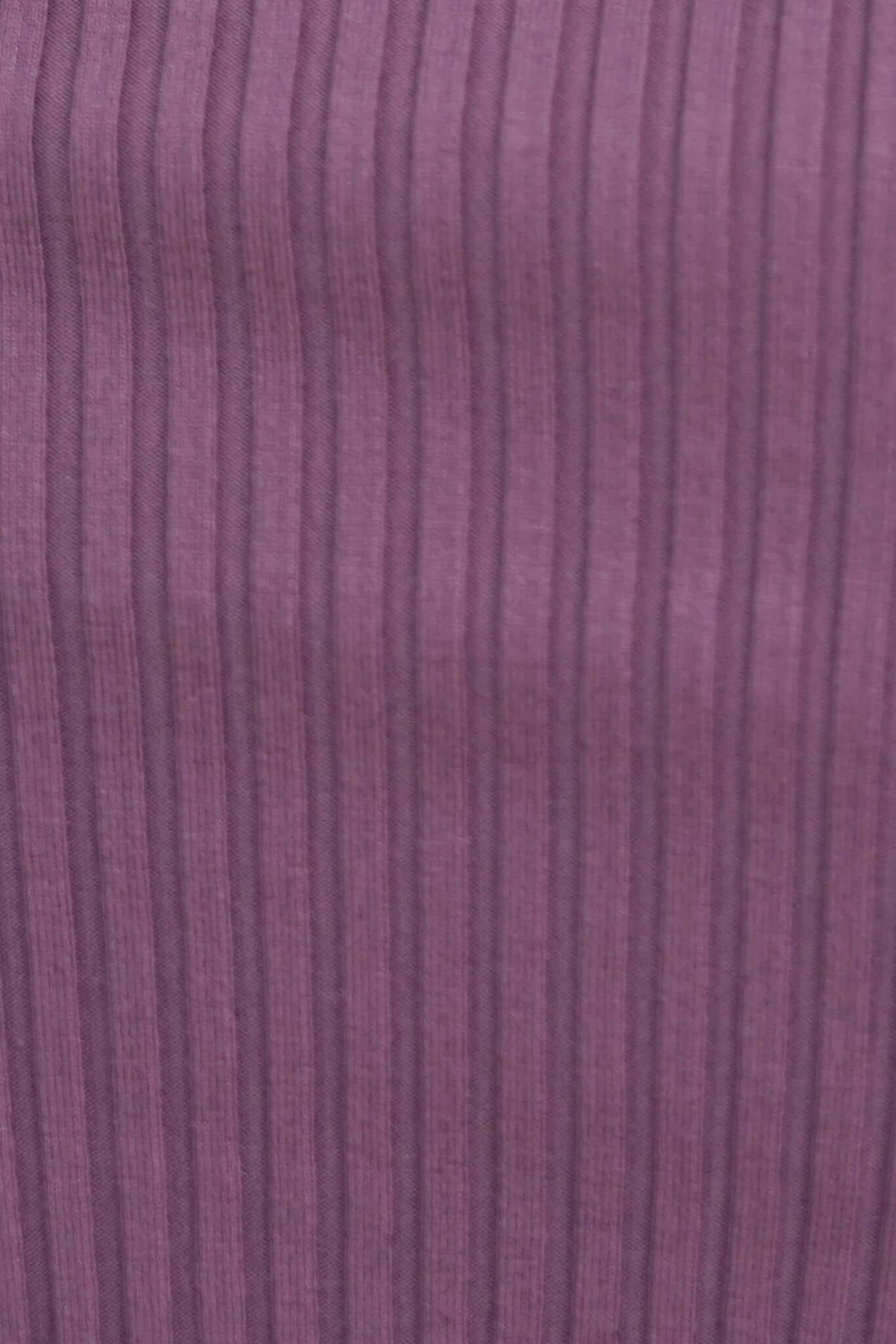 Close-up of ribbed knit fabric in a rich purple color, showcasing texture and stretch for the Durham Midi Dress.
