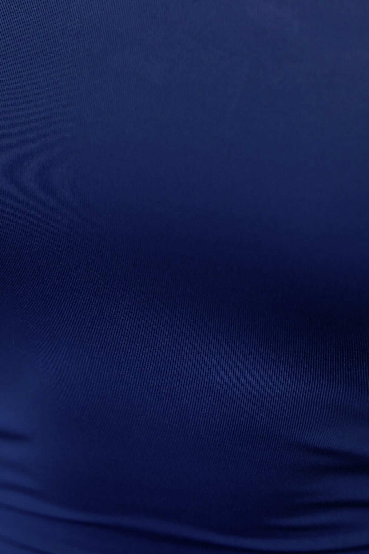 Close-up of the smooth navy fabric of the Qinley Maxi Dress, showcasing its quality and rich color.