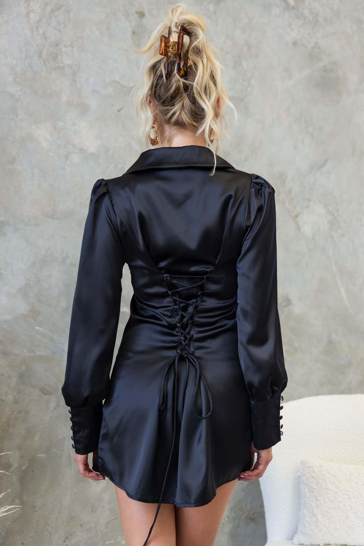 Back view of Findlay Dress in black with satin finish, featuring a collar and lace-up detail.